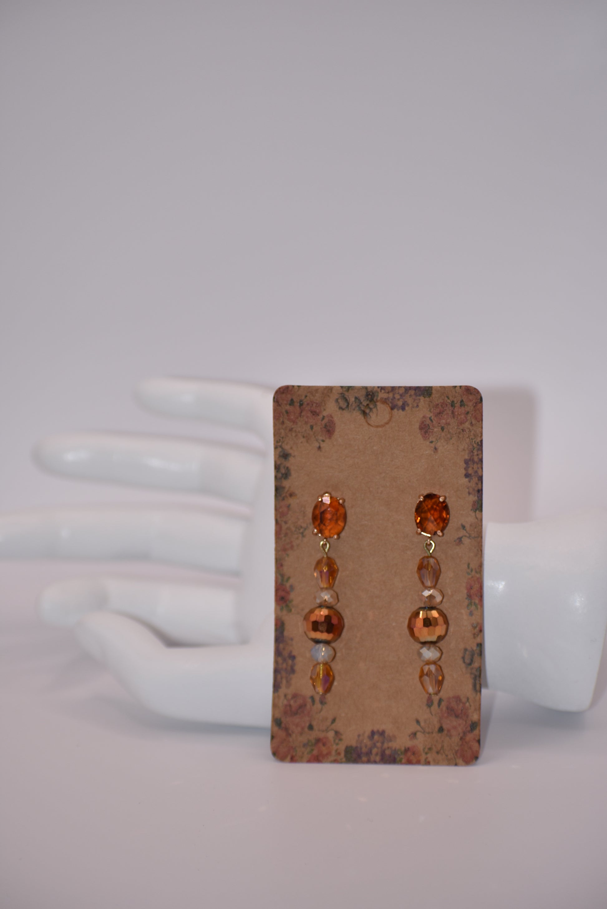 Introducing the Brown Collection - a one-of-a-kind piece that will make a statement wherever you go. These auburn gem oval post earrings are hypoallergenic, ensuring comfort for all. The beautiful crystals add a touch of sexiness and fun to your look. Don't miss out on this unique and stylish pair!