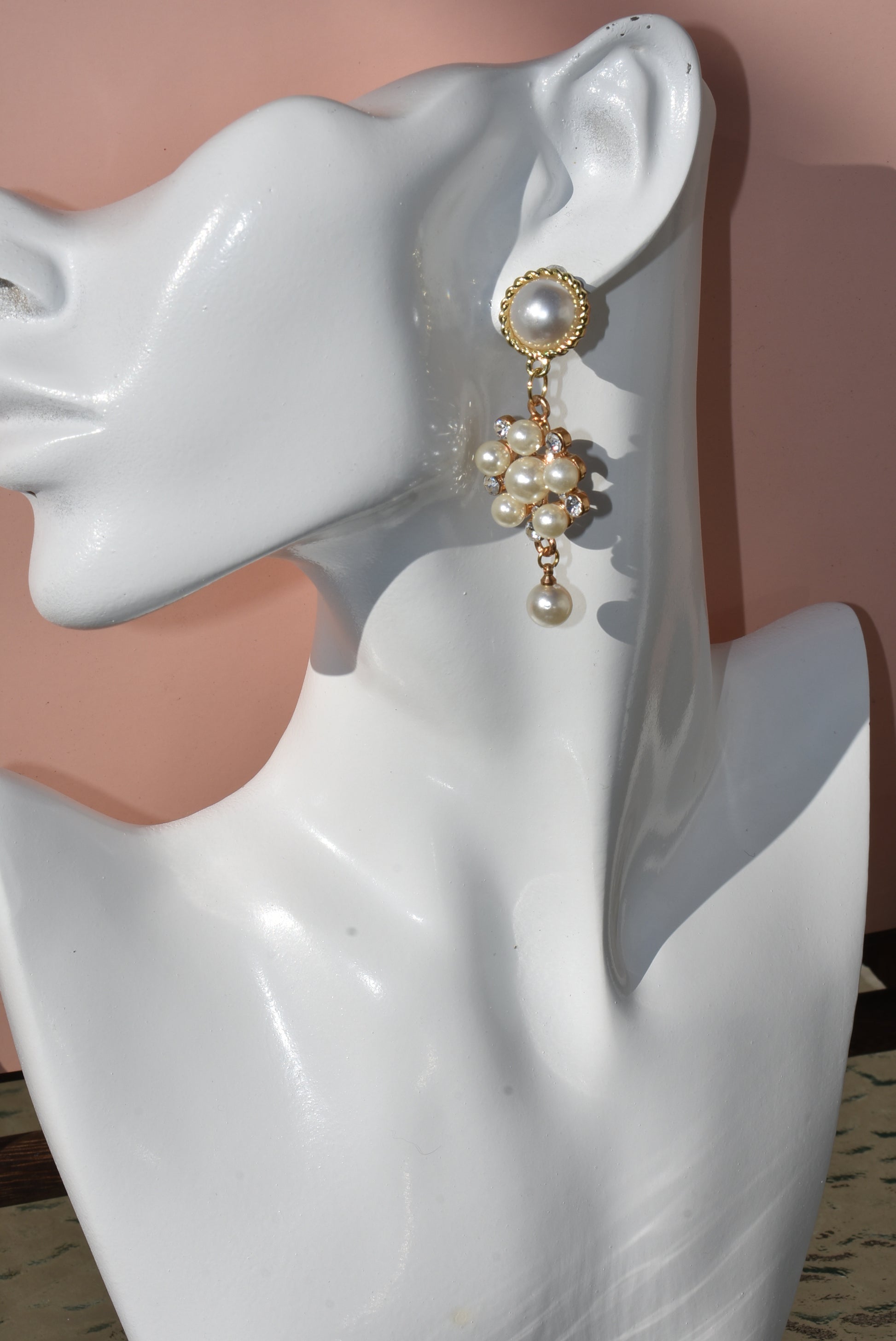 This stunning Wedding Collection features a picture perfect design perfect for any bride. Each beautiful pearl post holds an elegant pearl cluster with gem stones and is finished off with a hanging pearl at the bottom, making the perfect statement for a special day.