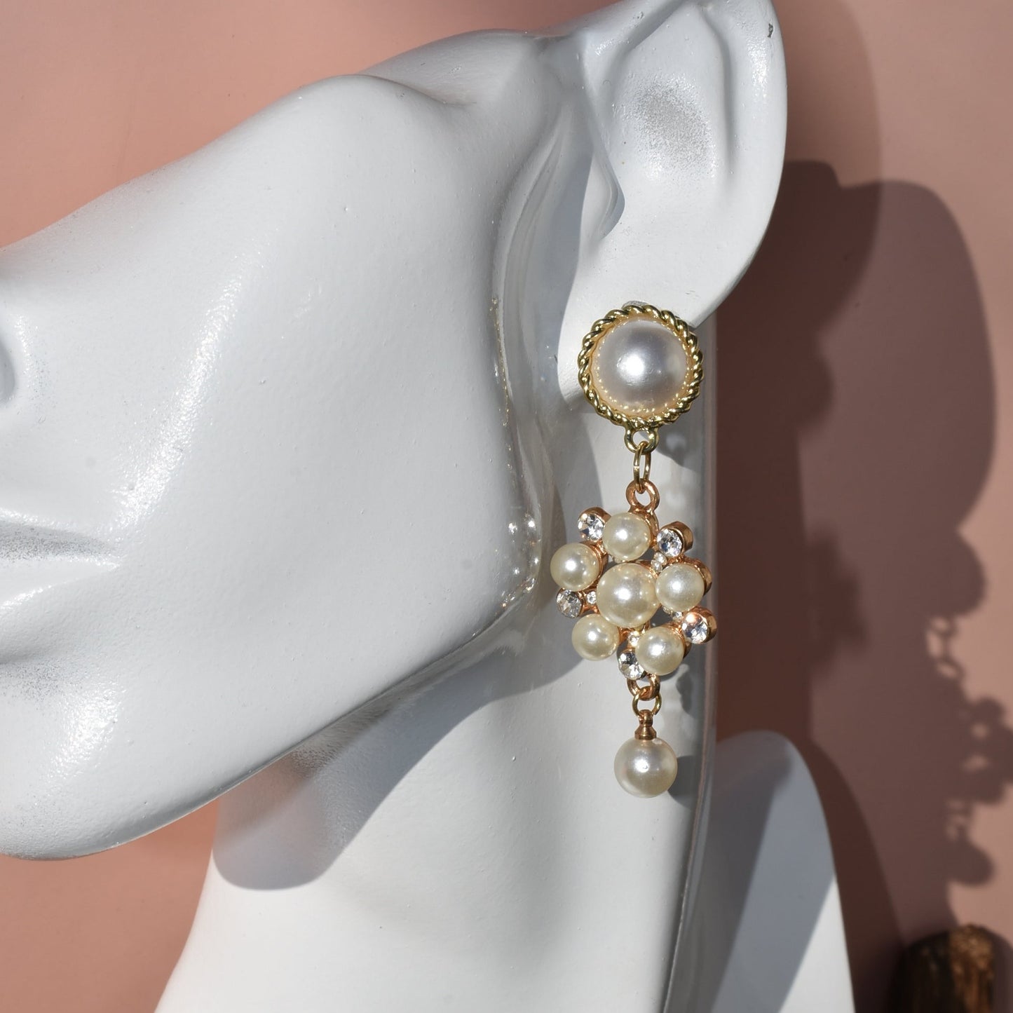 This stunning Wedding Collection features a picture perfect design perfect for any bride. Each beautiful pearl post holds an elegant pearl cluster with gem stones and is finished off with a hanging pearl at the bottom, making the perfect statement for a special day.