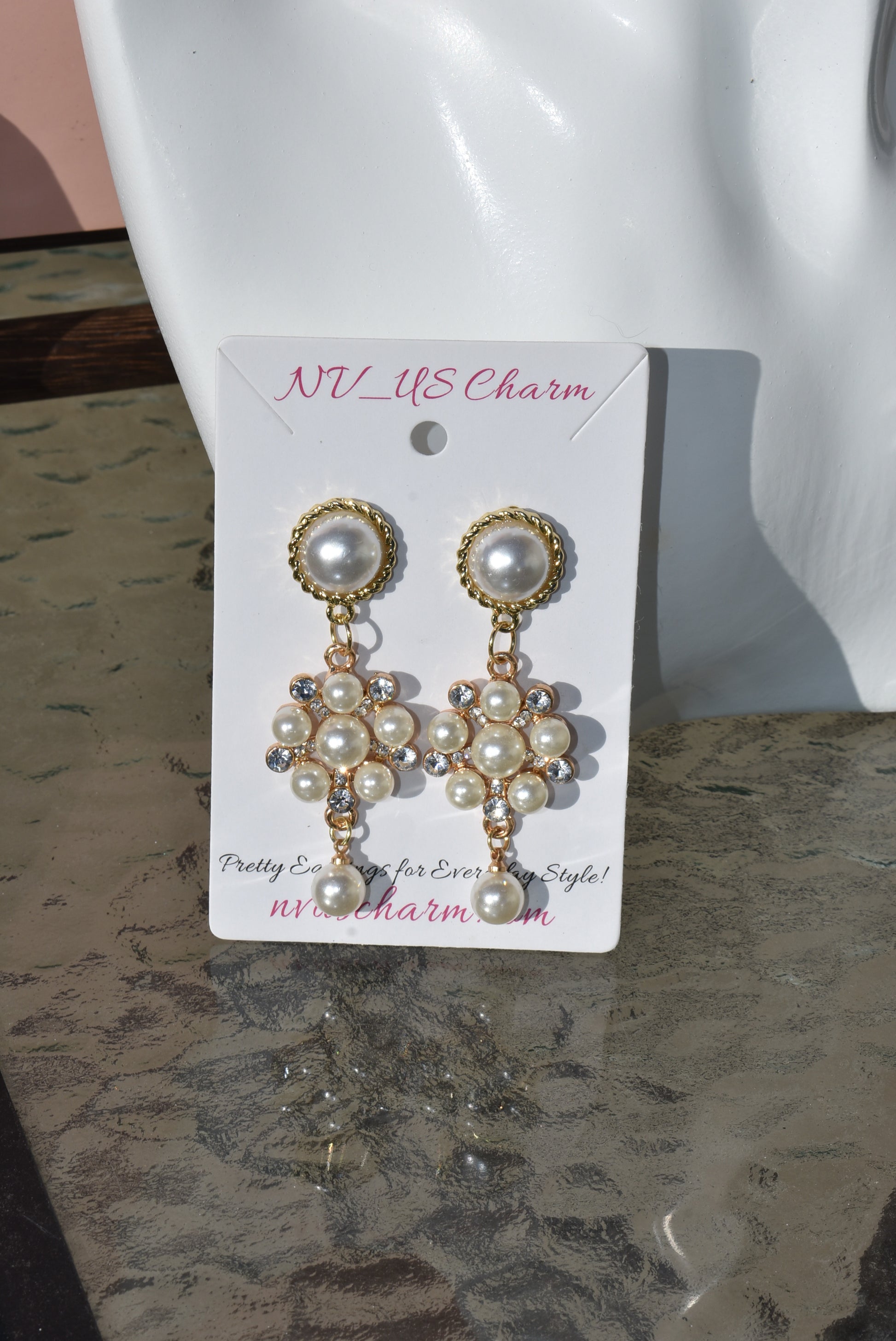 This stunning Wedding Collection features a picture perfect design perfect for any bride. Each beautiful pearl post holds an elegant pearl cluster with gem stones and is finished off with a hanging pearl at the bottom, making the perfect statement for a special day.