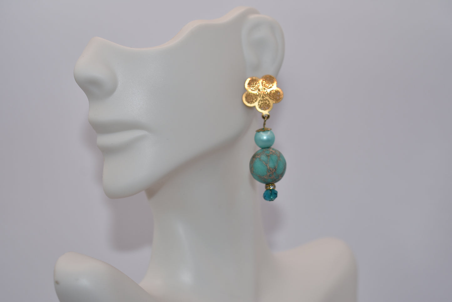 Get ready for adventure? These earrings are ready to go with you.&nbsp; Gold flowered hanging post earrings with aqua pearls, pretty beads and diamond crystal accents bring these beauties together. Nickel free and hypoallergenic for sensitive ears.&nbsp; Super comfortable on the ear.&nbsp; One-of-a-kind-piece.