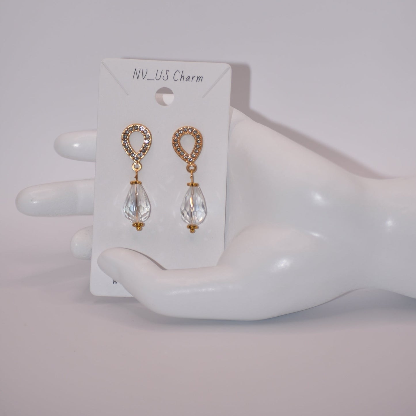 The Wedding Collection features elegant gold-filled earrings with hypoallergenic posts that hold a stunning teardrop crystal. Perfect for adding a touch of sophistication to any wedding ensemble, these earrings are simple yet elegant. Their delicate design is sure to make a statement.