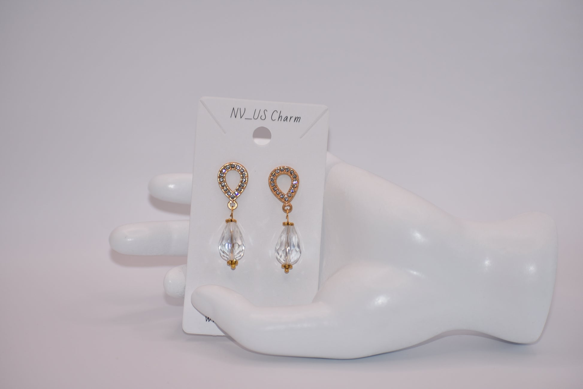 The Wedding Collection features elegant gold-filled earrings with hypoallergenic posts that hold a stunning teardrop crystal. Perfect for adding a touch of sophistication to any wedding ensemble, these earrings are simple yet elegant. Their delicate design is sure to make a statement.