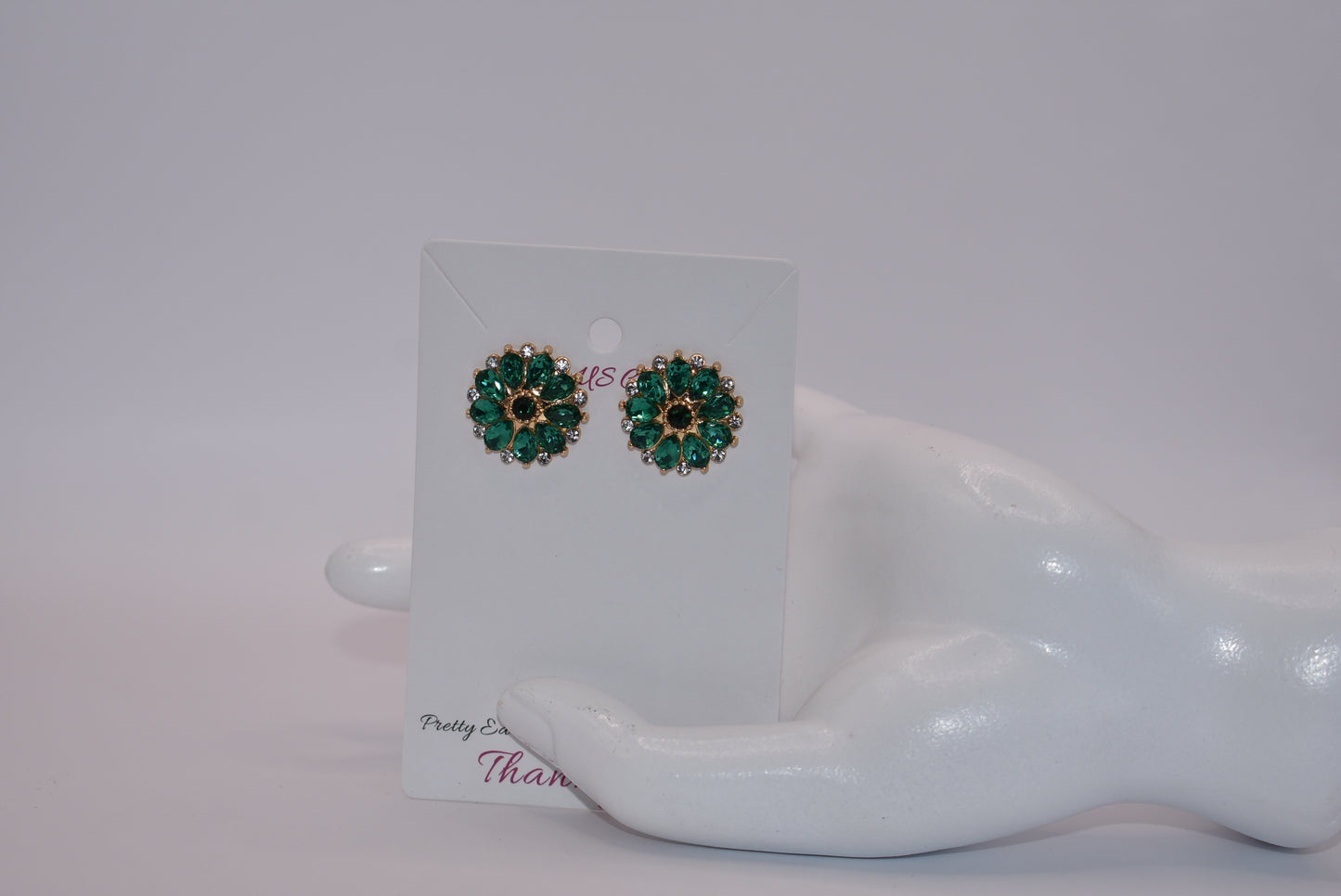 Unleash your unique style with our Green Collection earrings! These eye-catching post earrings feature hypoallergenic posts and stunning emerald green and white crystals. With a vintage-inspired design, you're sure to turn heads and make a statement. Perfect for any special occasion outfit!