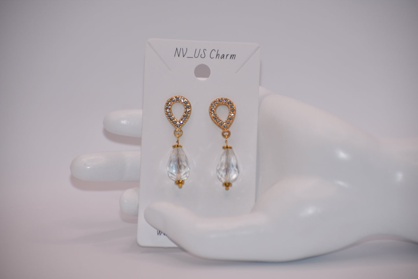 The Wedding Collection features elegant gold-filled earrings with hypoallergenic posts that hold a stunning teardrop crystal. Perfect for adding a touch of sophistication to any wedding ensemble, these earrings are simple yet elegant. Their delicate design is sure to make a statement.