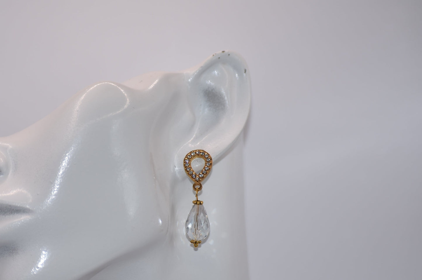 The Wedding Collection features elegant gold-filled earrings with hypoallergenic posts that hold a stunning teardrop crystal. Perfect for adding a touch of sophistication to any wedding ensemble, these earrings are simple yet elegant. Their delicate design is sure to make a statement.