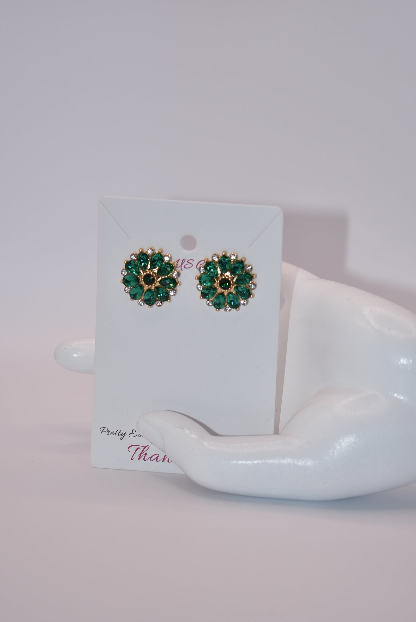 Unleash your unique style with our Green Collection earrings! These eye-catching post earrings feature hypoallergenic posts and stunning emerald green and white crystals. With a vintage-inspired design, you're sure to turn heads and make a statement. Perfect for any special occasion outfit!