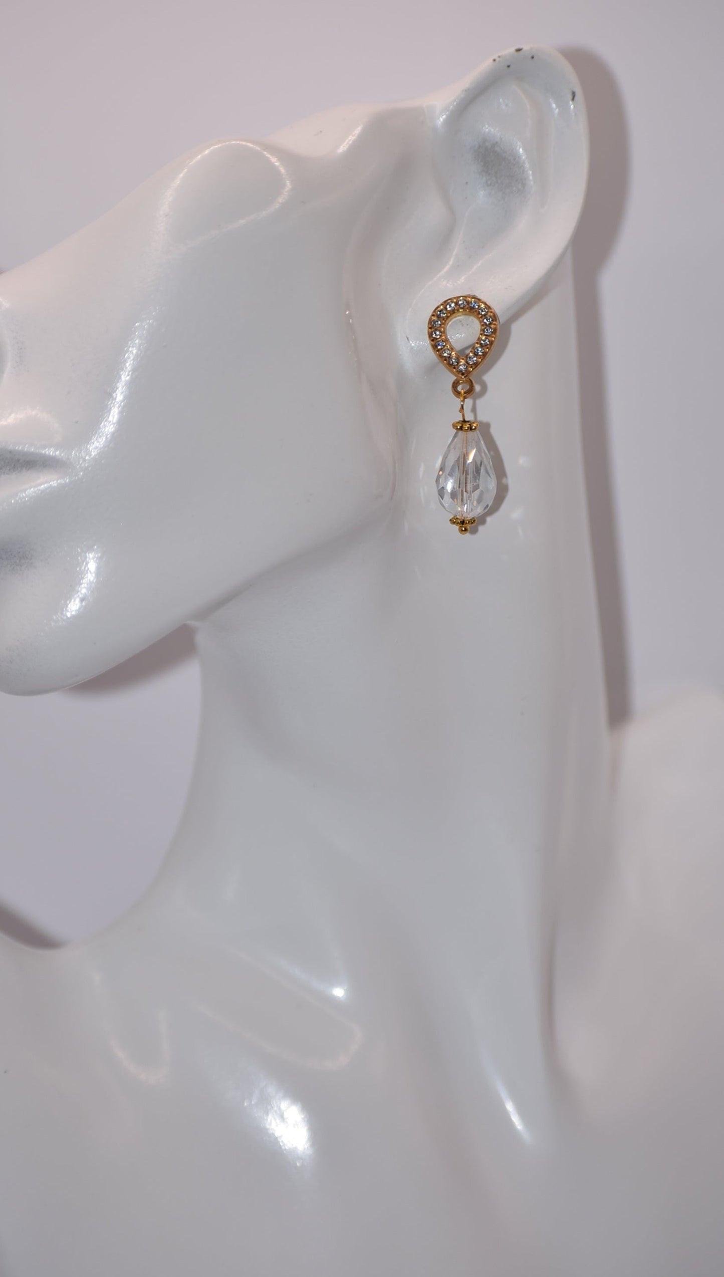 The Wedding Collection features elegant gold-filled earrings with hypoallergenic posts that hold a stunning teardrop crystal. Perfect for adding a touch of sophistication to any wedding ensemble, these earrings are simple yet elegant. Their delicate design is sure to make a statement.