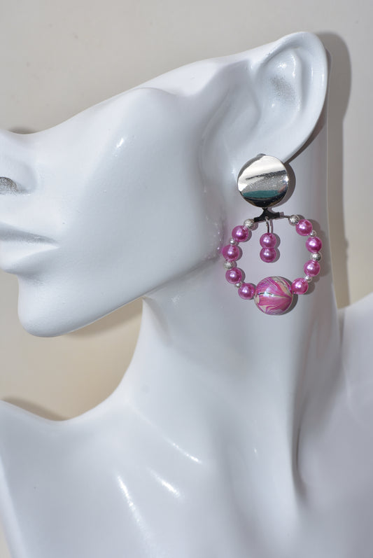 The perfect blend of pink & tiny white pearls with silver beads in between holds this pretty set together.  They hang from bigger round silver posts for comfort.  This is a one-of-a-kind piece.   