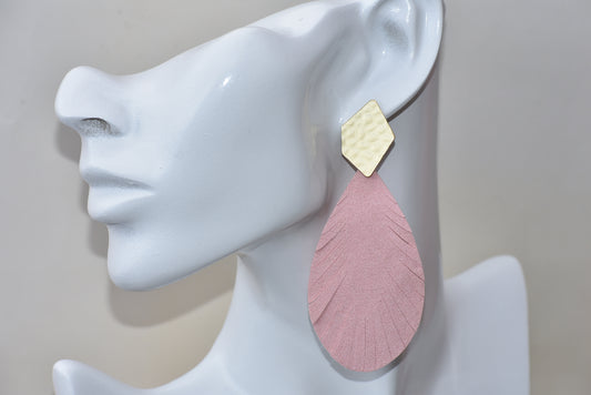 These pink faux suede earrings have a sophisticated look with gold shaped posts and an elegant, fringed design. The lightweight nature of these earrings make them exceptionally comfortable to wear.