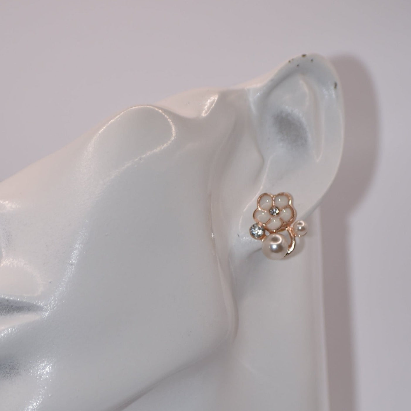 Exude elegance on your special day with our Wedding Collection. These post earrings feature a beautiful flower design adorned with luxurious pearls and crystals, adding a touch of class to your look. Comfortable for all-day wear, they are perfect for the bride or even the mother of the bride.