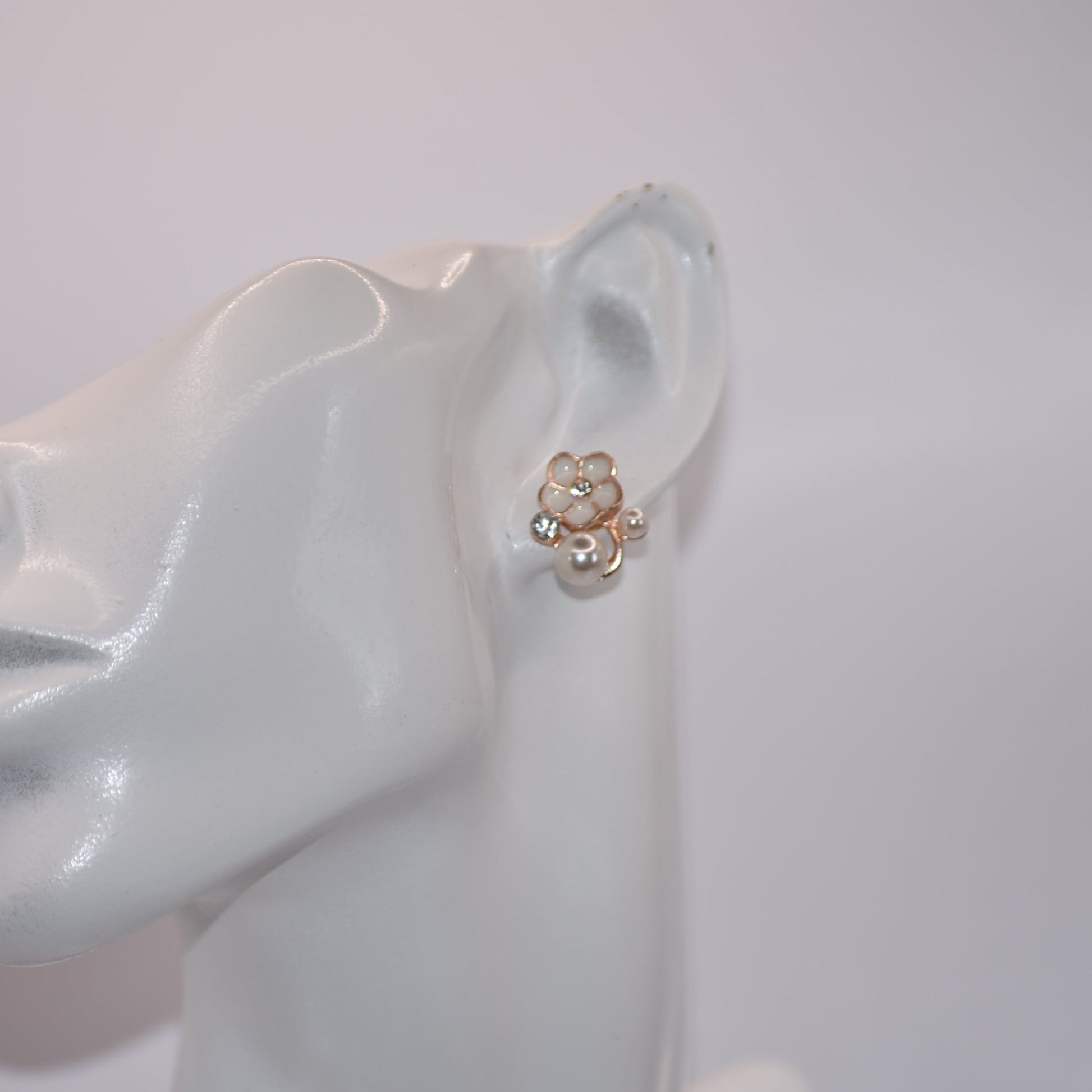 Exude elegance on your special day with our Wedding Collection. These post earrings feature a beautiful flower design adorned with luxurious pearls and crystals, adding a touch of class to your look. Comfortable for all-day wear, they are perfect for the bride or even the mother of the bride.