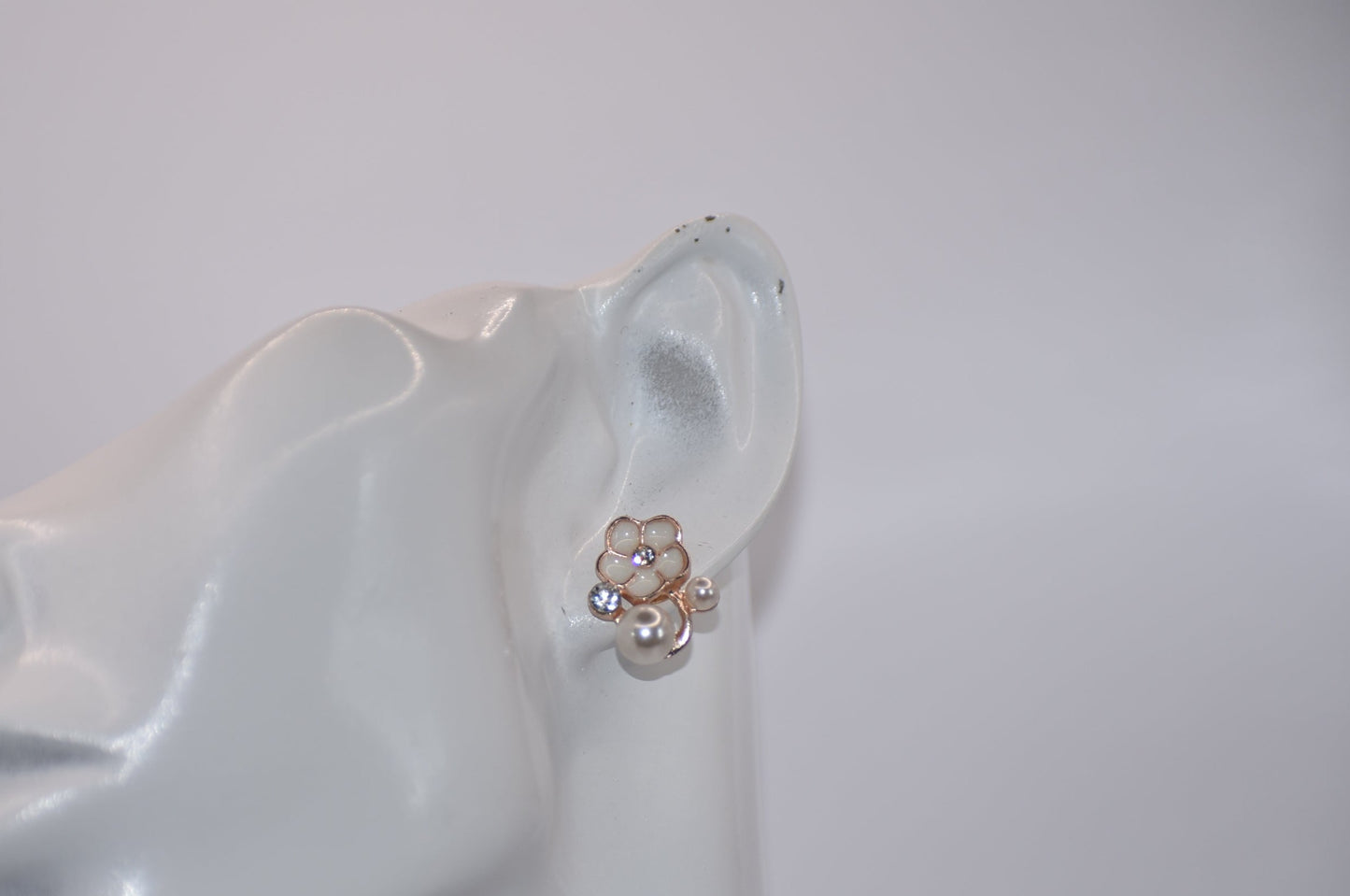 Exude elegance on your special day with our Wedding Collection. These post earrings feature a beautiful flower design adorned with luxurious pearls and crystals, adding a touch of class to your look. Comfortable for all-day wear, they are perfect for the bride or even the mother of the bride.