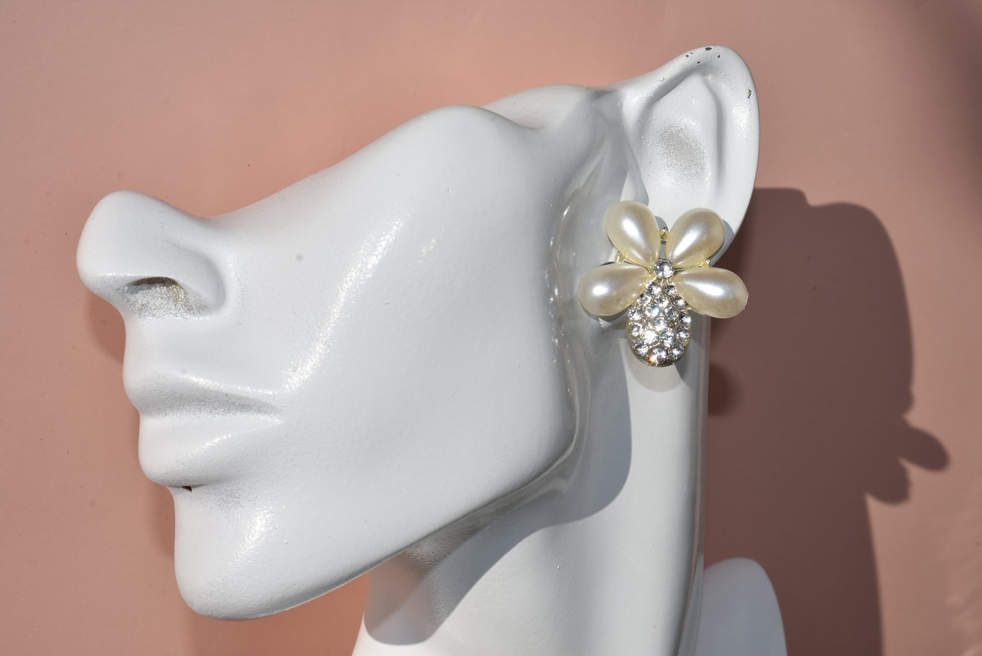 Don't settle for a run-of-the-mill wedding look! Make your big day sparkle with our Wedding Collection! Our one-of-a-kind earrings feature an ultra-glam pearl and gem flower design, and are lightweight and comfy on the ear. Plus, they're hypoallergenic so they won't weigh you down with sensitivities - now that's something to say "I do" to!