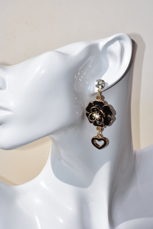 These black beauties are diamond posts with black flowers with middle crystal and have a hanging black open heart on the bottom.  They are on the heavier side. Gorgeous on the ear.  One-of-a-kind piece.