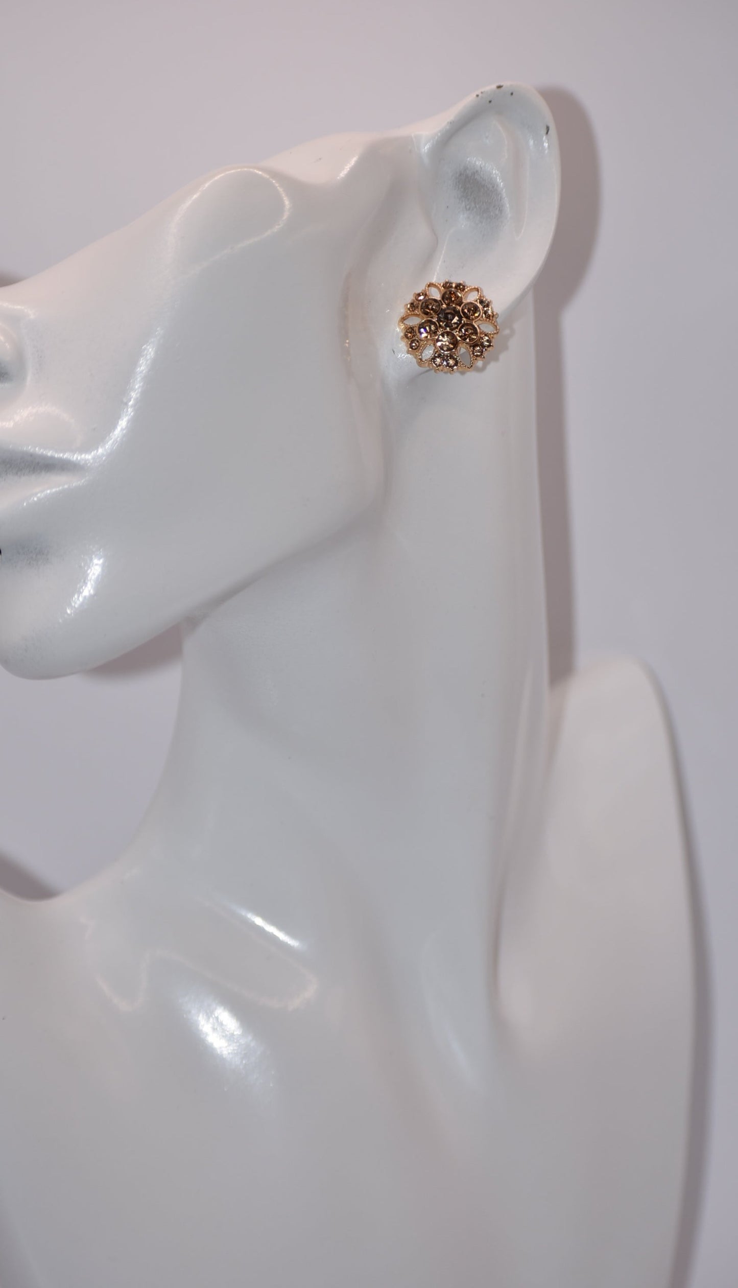 These charming auburn crystal flower earrings add a touch of elegance to your wedding look. The hypoallergenic gold posts provide all-day comfort for sensitive ears. Fall in love with the perfect amount of bling.