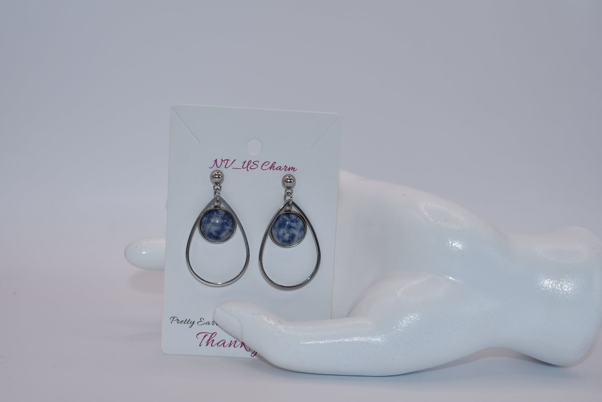 "Add some unique flair to your everyday look with our Blue Collection earrings! These silver hypoallergenic posts hold a teardrop open with a stunning cabochon stone center, ensuring both style and comfort. Perfect for all-day wear. (Your ears will thank you.)"&nbsp; Earrings can be work teardrop point up or down.&nbsp; Your choice gives you some variety