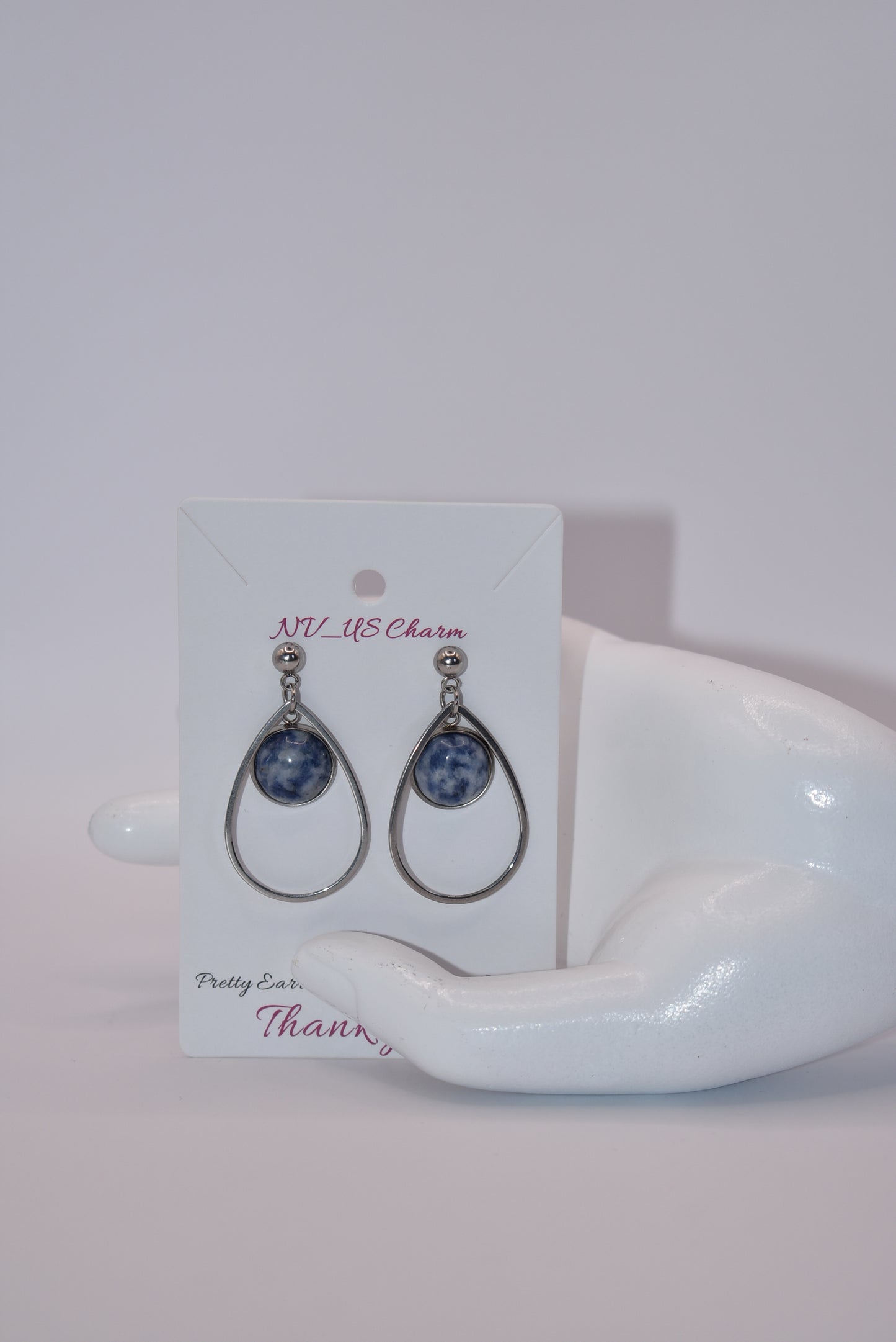 "Add some unique flair to your everyday look with our Blue Collection earrings! These silver hypoallergenic posts hold a teardrop open with a stunning cabochon stone center, ensuring both style and comfort. Perfect for all-day wear. (Your ears will thank you.)"&nbsp; Earrings can be work teardrop point up or down.&nbsp; Your choice gives you some variety