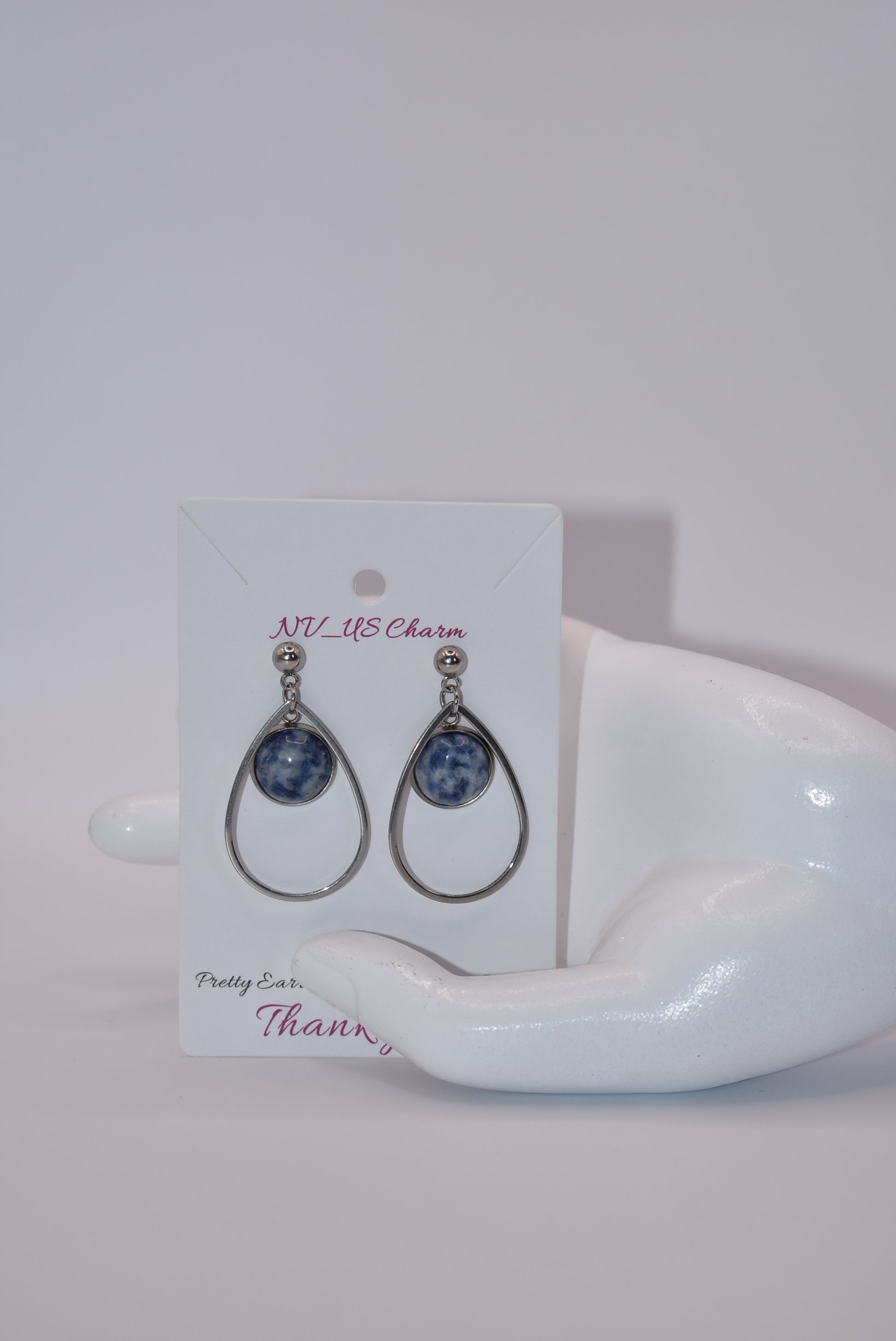 "Add some unique flair to your everyday look with our Blue Collection earrings! These silver hypoallergenic posts hold a teardrop open with a stunning cabochon stone center, ensuring both style and comfort. Perfect for all-day wear. (Your ears will thank you.)"&nbsp; Earrings can be work teardrop point up or down.&nbsp; Your choice gives you some variety