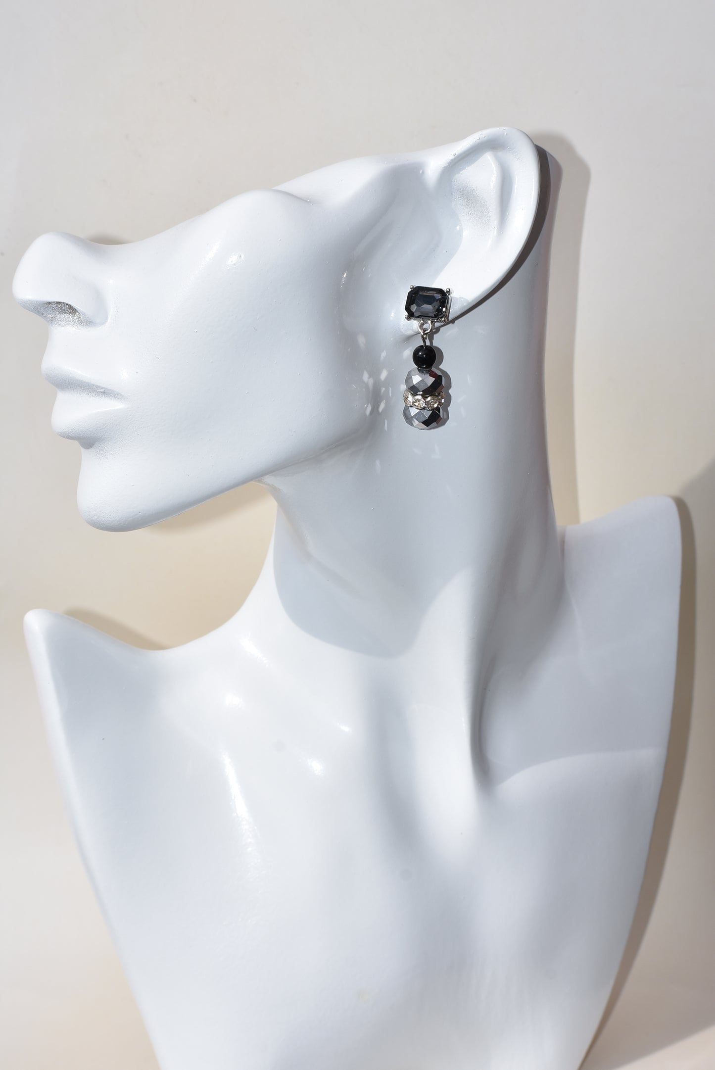 This Black Collection 13 earring set is crafted featuring exquisite black crystal square posts and intricately detailed gray and black beading. This timeless jewelry piece is designed to last, perfect for formal occasions or everyday wear.