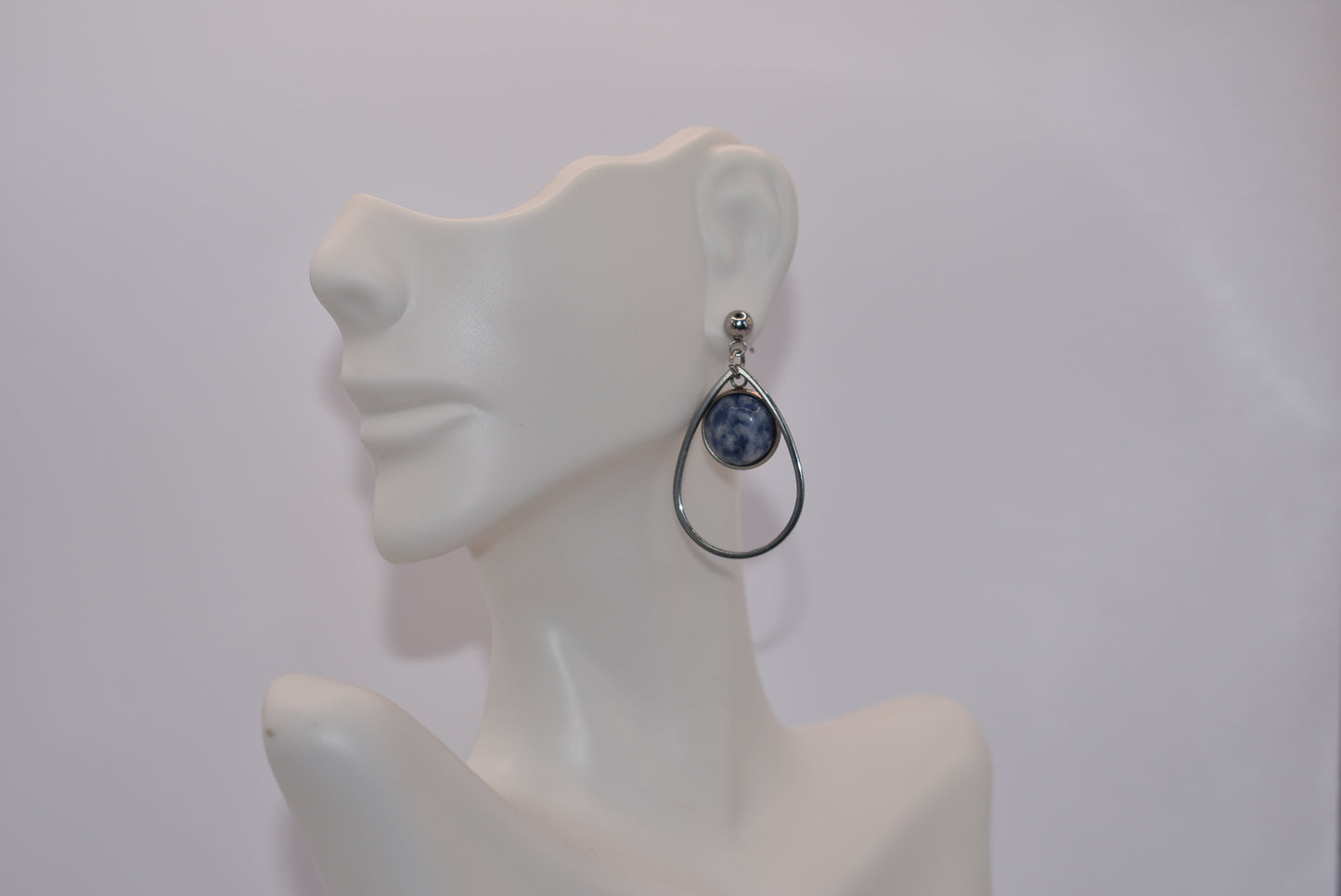 "Add some unique flair to your everyday look with our Blue Collection earrings! These silver hypoallergenic posts hold a teardrop open with a stunning cabochon stone center, ensuring both style and comfort. Perfect for all-day wear. (Your ears will thank you.)"&nbsp; Earrings can be work teardrop point up or down.&nbsp; Your choice gives you some variety