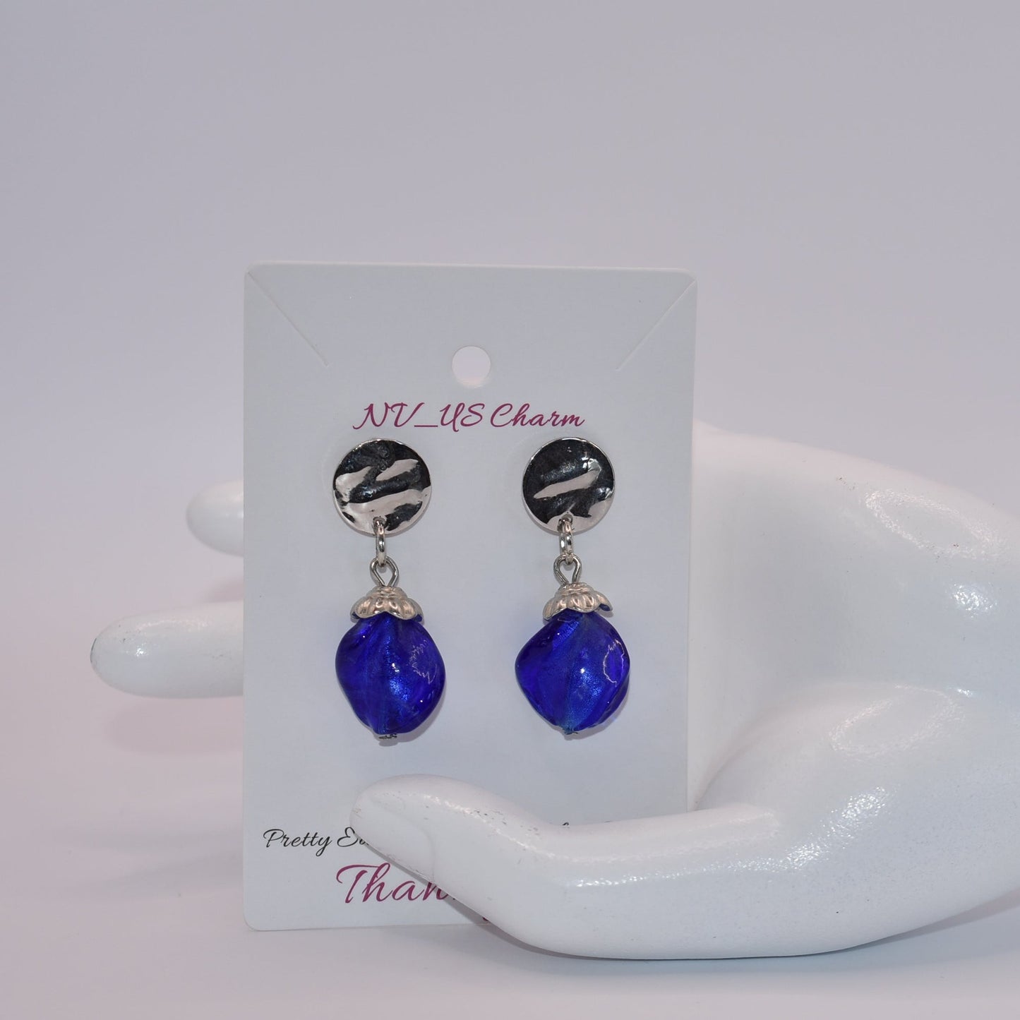 Get ready to add some sparkle to your accessories with the Blue Collection! These earrings feature silver round hypoallergenic posts and hold a stunning sapphire blue stone. Dress them up or down for any occasion - these earrings are the perfect addition to any outfit!