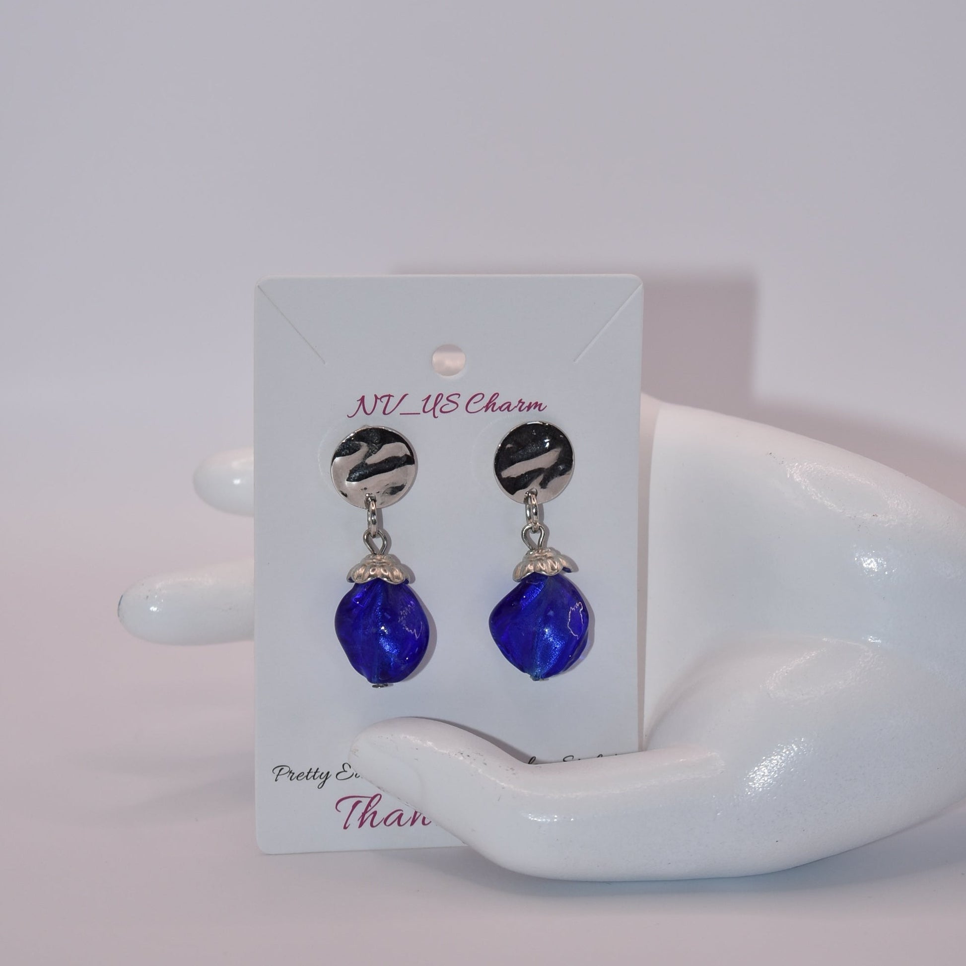 Get ready to add some sparkle to your accessories with the Blue Collection! These earrings feature silver round hypoallergenic posts and hold a stunning sapphire blue stone. Dress them up or down for any occasion - these earrings are the perfect addition to any outfit!