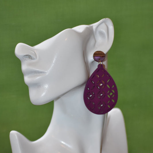 Our Purple Collection earrings are the perfect adornment for any fashionista who loves to show off their purpleness! These gorgeous, teardrop-shaped earrings hang from a post made of hypoallergenic material, ensuring that even those with sensitive ears can enjoy their lavender and wood-colored beauty! So, go ahead - indulge in a little bit of purple perfection!