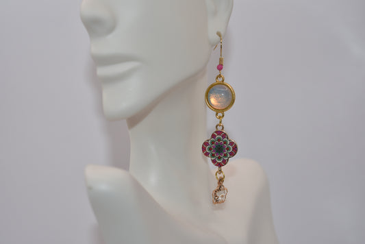 Add a touch of whimsy to your look with our Pink Collection earrings. These pretty gold hook earrings feature a hypoallergenic design, perfect for sensitive ears. The arro decent cabochon stone is complemented by a charming pink flower design, and finished with a sparkling crystal charm. Hangs 3 1/2 inches from the ear.