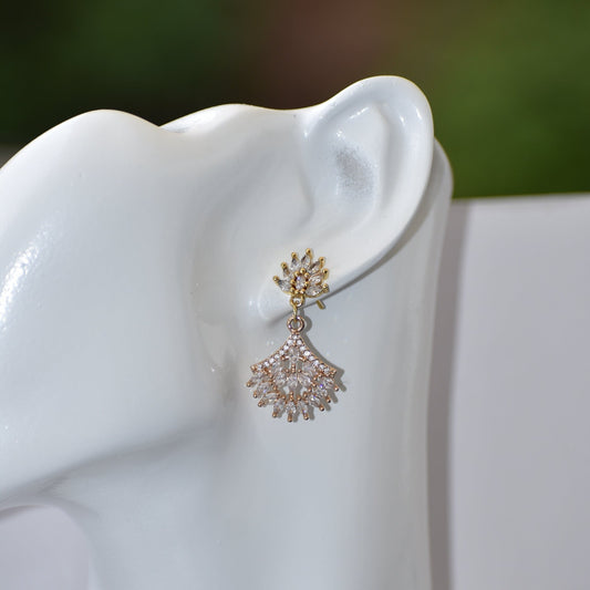 This Wedding Collection sparkles with its stunning cubic zirconia stud earrings and hanging crystal fan design charm. Perfectly elegant and sexy, they'll be sure to turn heads on the big day.