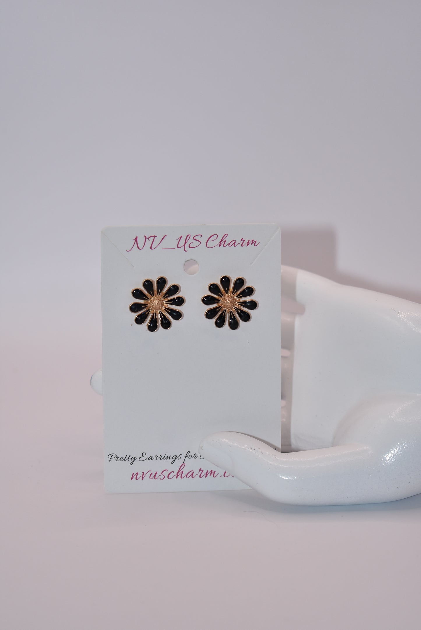 Add some style to your post earring game with the Black Collection. Featuring black flowers with gold accents, these hypoallergenic earrings are perfect for day or night. Show off your quirky side with this playful, yet sophisticated design.