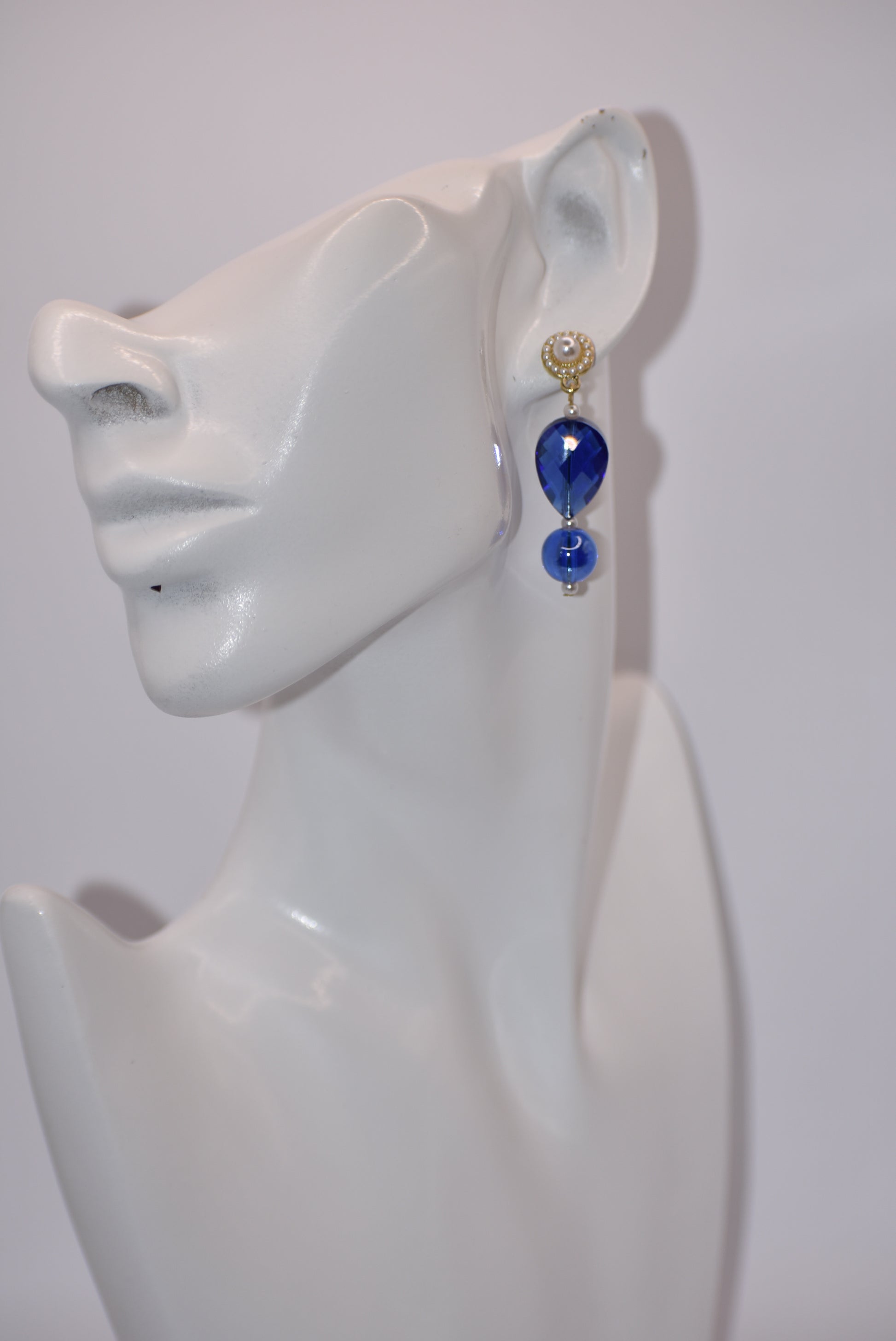 ntroducing our Wedding Collection - the perfect pair for any wedding. These beautiful pearl round posts feature stunning cobalt blue gems with delicate pearl accents. Whether it's for the mother-in-law, mother of the bride, or the bride herself, this one-of-a-kind piece is sure to make anyone fall in love. Don't miss out on this unique and elegant addition to your special day.