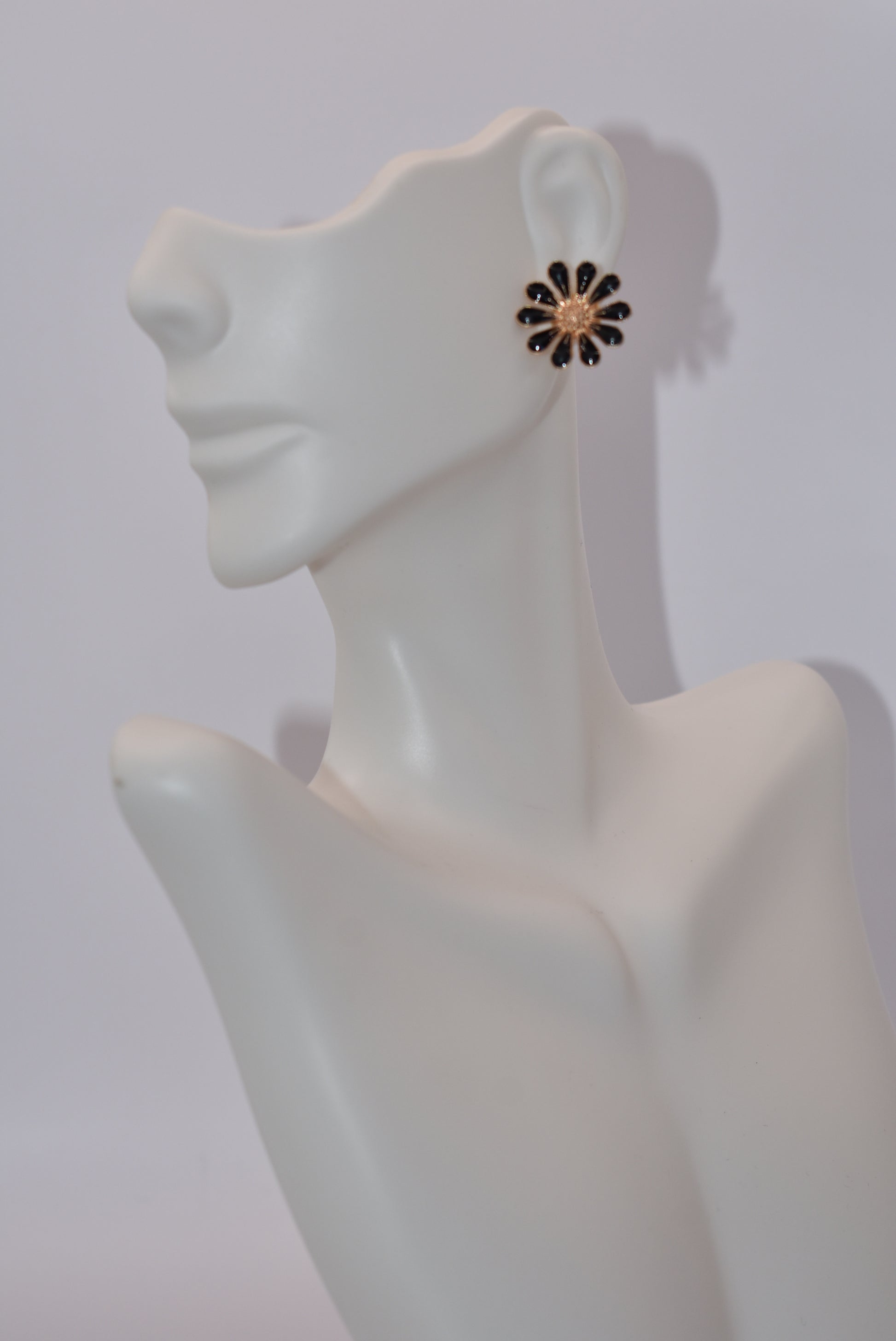 Add some style to your post earring game with the Black Collection. Featuring black flowers with gold accents, these hypoallergenic earrings are perfect for day or night. Show off your quirky side with this playful, yet sophisticated design.