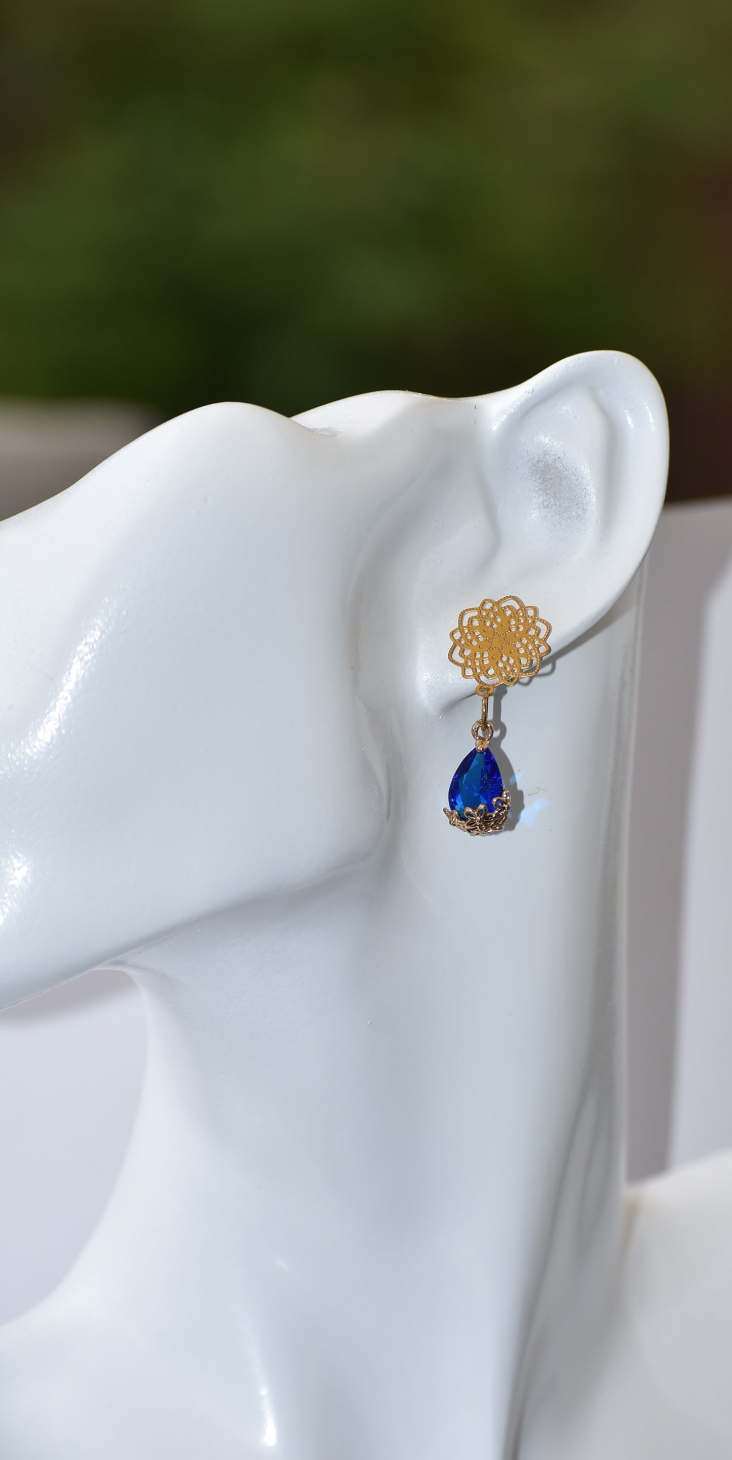 Our exquisite Blue Collection features beautiful gold filled filigree posts with a stunning blue gemstone held within a sophisticated gold filigree flower. A truly stunning piece of jewelry that will not go unnoticed.