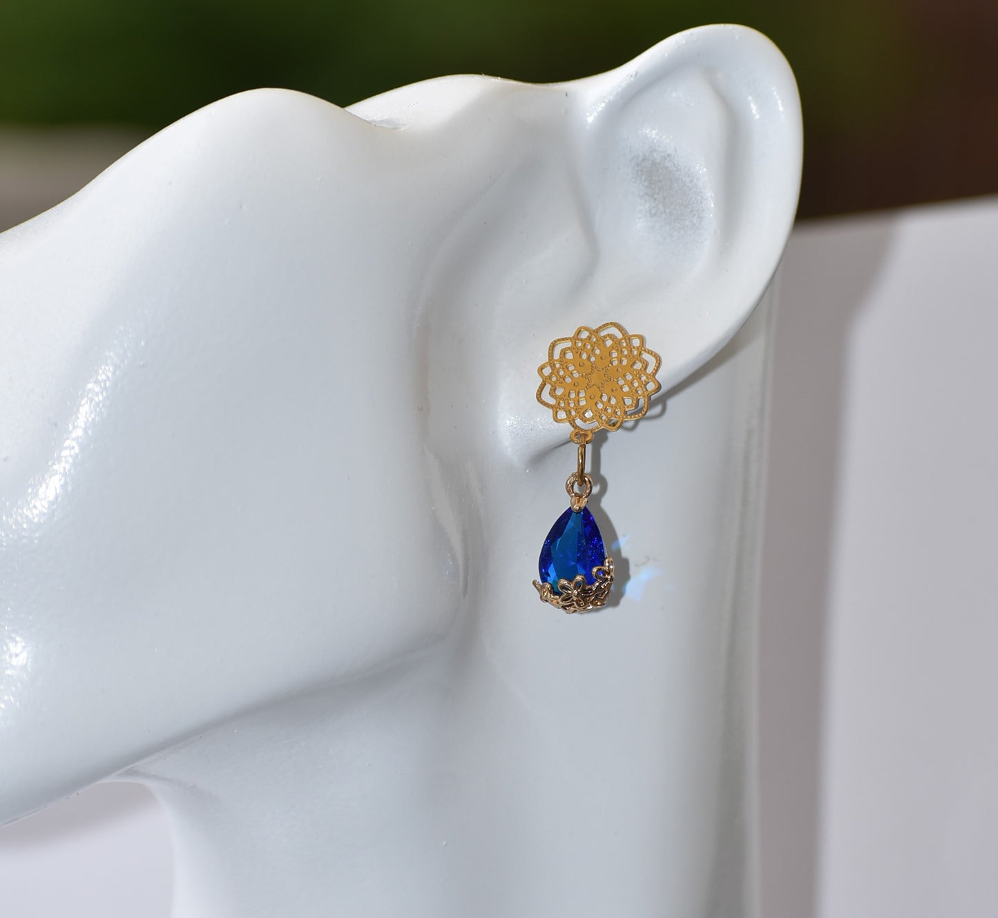 Our exquisite Blue Collection features beautiful gold filled filigree posts with a stunning blue gemstone held within a sophisticated gold filigree flower. A truly stunning piece of jewelry that will not go unnoticed.