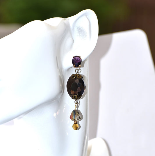 Be bold with the Purple Collection, featuring a pair of gorgeous amethyst post earrings. The cascading purple layers hang from the top, creating a statement accessory that's both chic and eye-catching. Add a touch of glamour to your look with these show-stopping earrings.