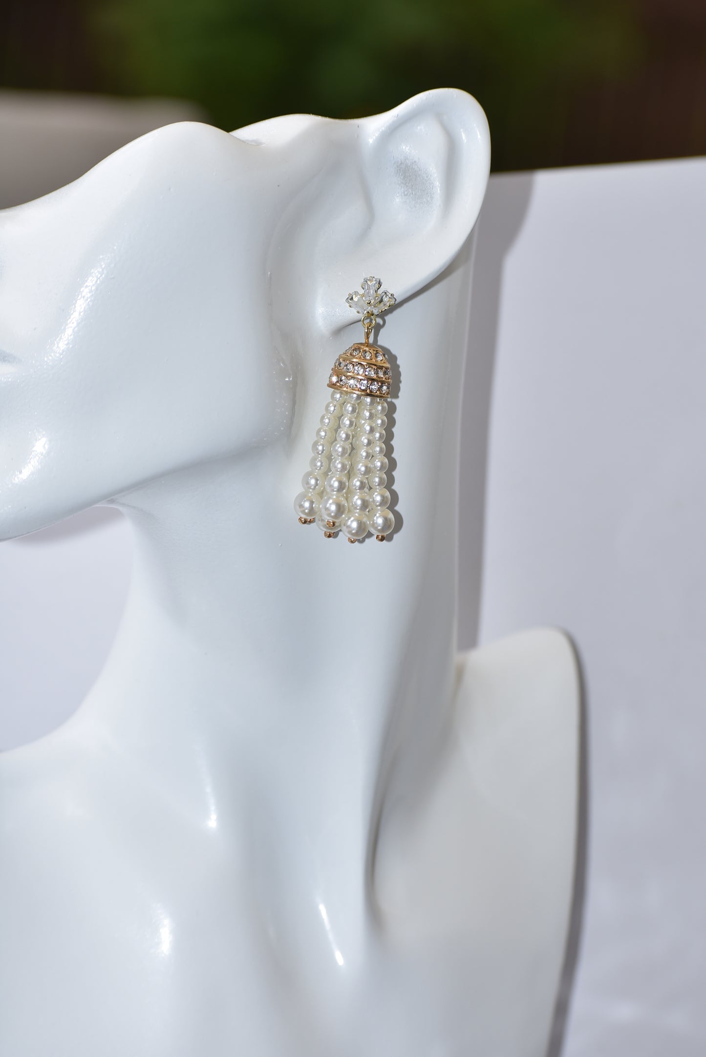 Our Wedding Collection is a beautiful and luxurious addition to any special occasion. Crafted with quality cubic zirconia studs and a dome crystal piece, these earrings are complemented by a delicate pearl strands. These earrings are hypoallergenic and perfect for any wedding.