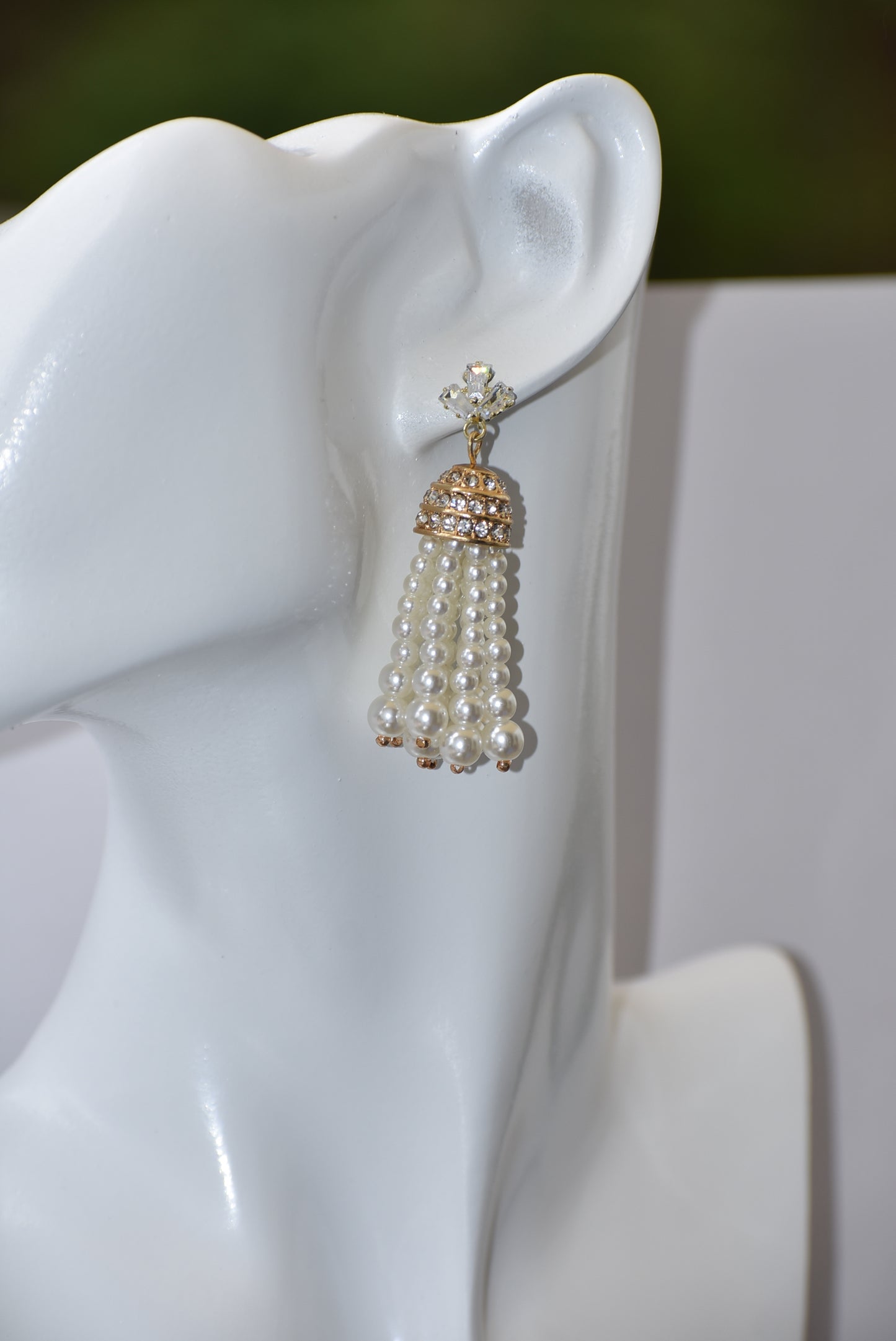 Our Wedding Collection is a beautiful and luxurious addition to any special occasion. Crafted with quality cubic zirconia studs and a dome crystal piece, these earrings are complemented by a delicate pearl strands. These earrings are hypoallergenic and perfect for any wedding.