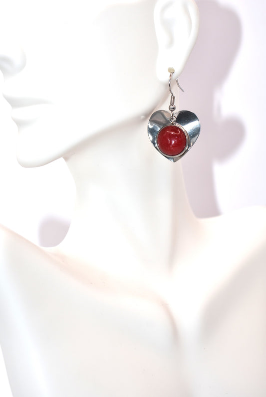 Elevate your everyday look with our Red Collection! These heart hook earrings, made from durable stainless steel, feature a stunning red cabochon stone that will surely make a statement. Get ready to feel special (and stylish) every day with these quirky and playful earrings.