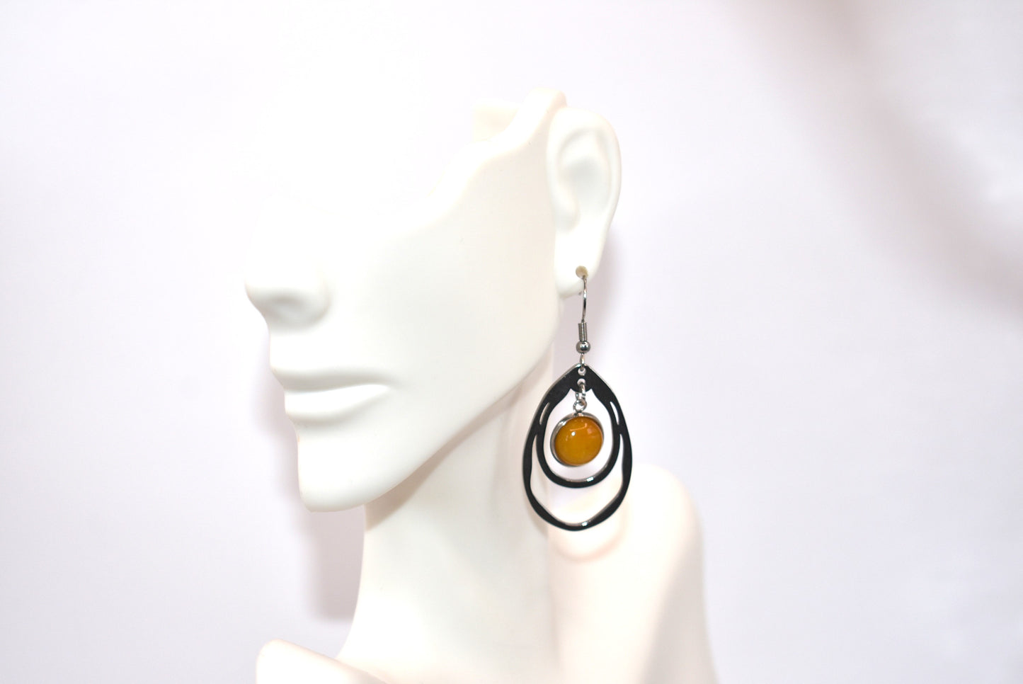 Add a touch of sunshine to your outfit with our Yellow Collection earrings. Made with hypoallergenic stainless-steel hooks, these beautiful hanging earrings feature a stunning cabochon stone in a bright and bold yellow hue. So comfortable and stylish, they'll make your look pop!