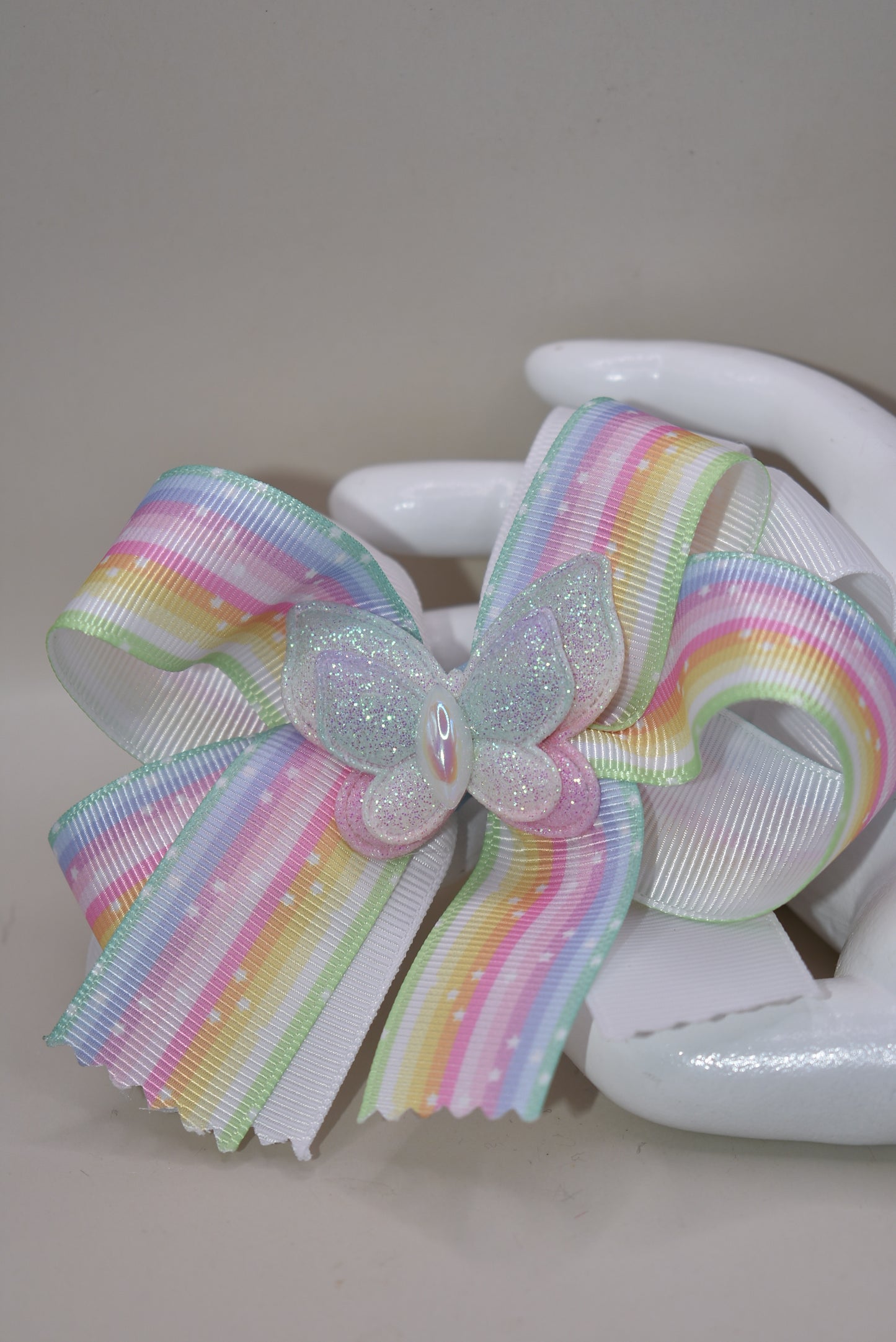 Elevate your little one's style with this enchanting pastel rainbow ribbon bow! 🌈✨ Topped with a sparkly butterfly that catches the light, this adorable hair accessory brings magical charm to any outfit. 🦋 The secure alligator clip ensures it stays put through all her adventures! Perfect for your color-loving princess who wants to stand out with playful flair. 💕 #NanasCollection