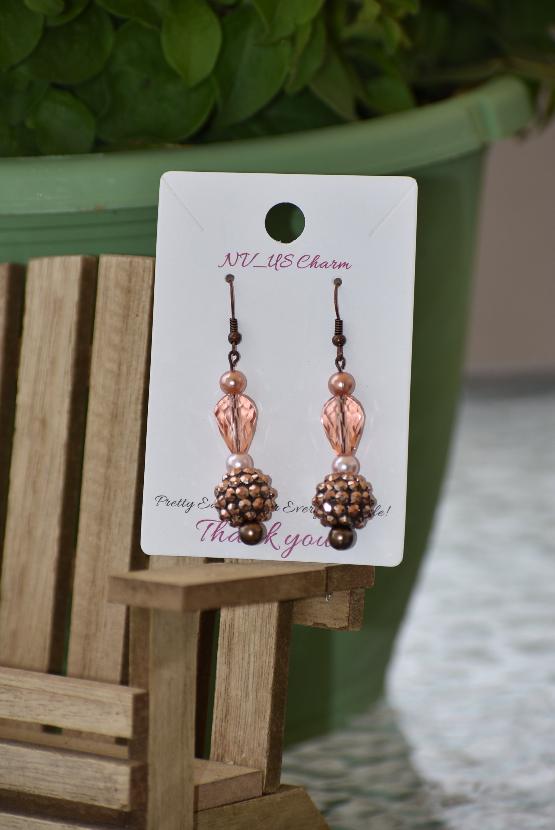 The Brown Collection 12 features stunning yet lightweight copper earrings with a unique combination of peach and copper beads and pearls. Hang in perfect proportions at the perfect length, these beautiful earrings are the perfect finishing touch to any ensemble.