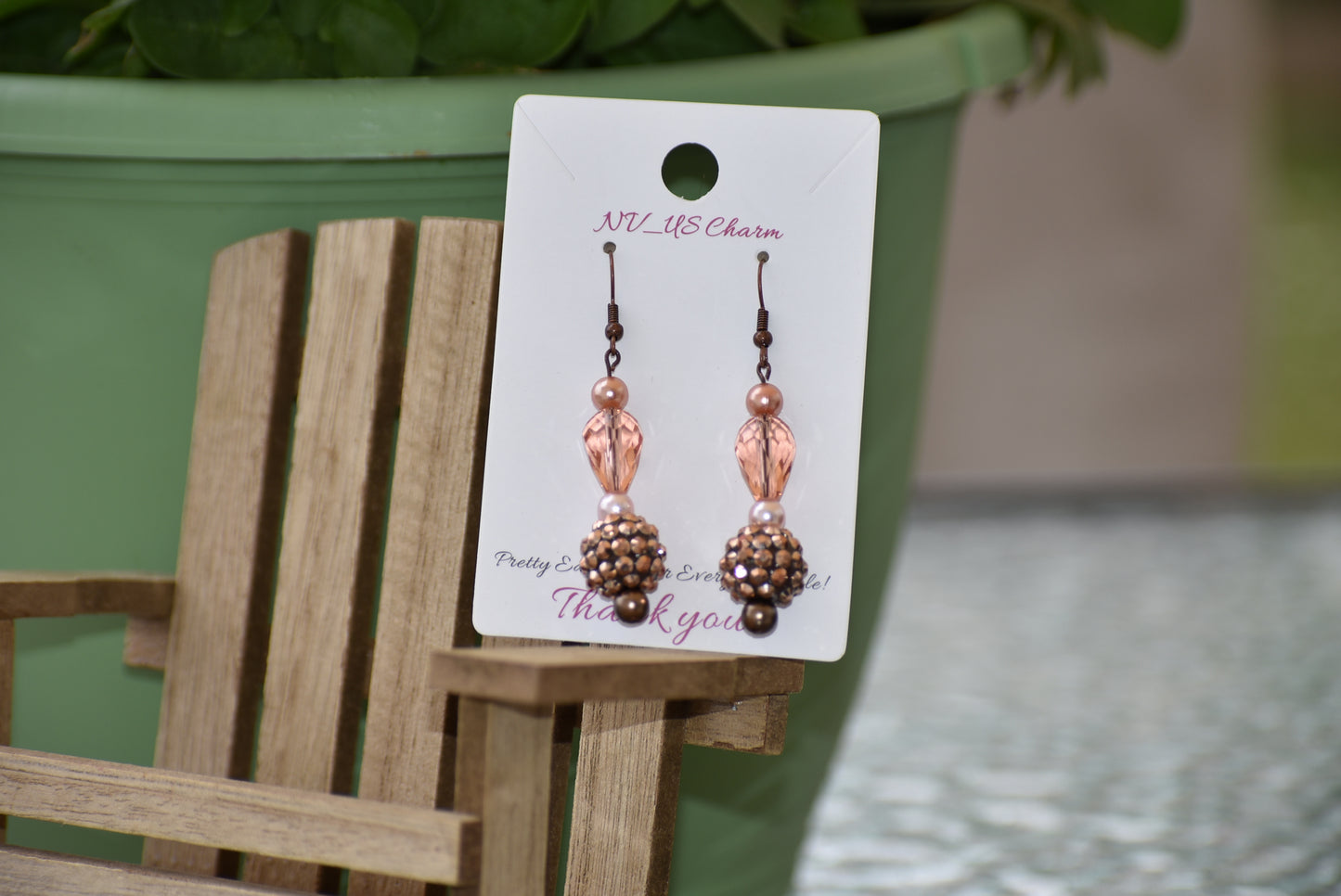 The Brown Collection 12 features stunning yet lightweight copper earrings with a unique combination of peach and copper beads and pearls. Hang in perfect proportions at the perfect length, these beautiful earrings are the perfect finishing touch to any ensemble.