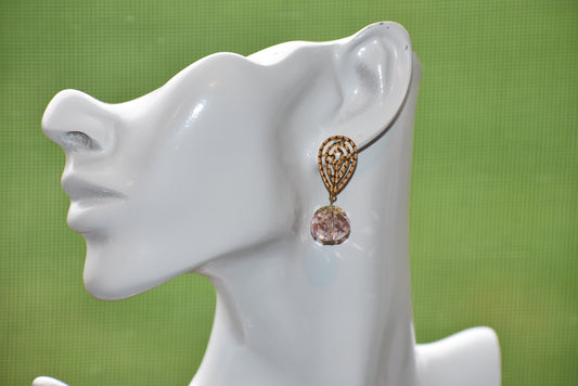 The Pink Collection offers simplicity and elegance with its stunning ball crystal and pear-shaped filigree gold-filled post earrings. Delicate yet comfortable for all-day wear, these earrings are the perfect addition to any outfit.