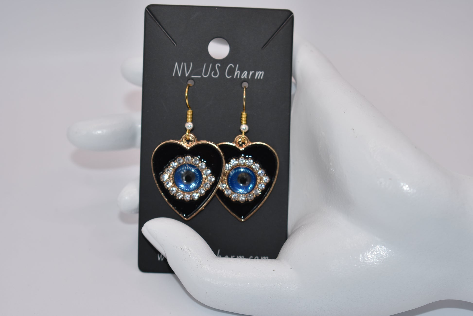 Introducing our Blue Collection, featuring our stunning evil eye earrings. These hypoallergenic earrings not only make a statement, but also provide protection from evil eyes. The black background makes the evil eye pop, adding a touch of beauty to your look. (You'll literally be turning heads)