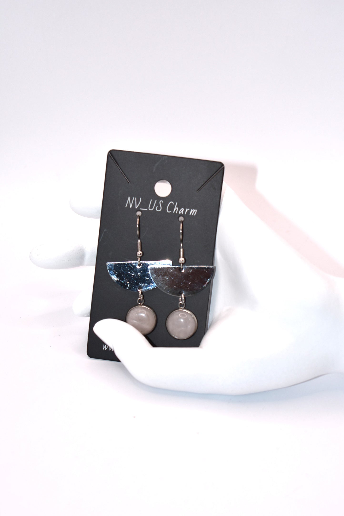 Upgrade your earring game with our Gray Collection. These stainless-steel half-moon earrings feature gray agate stones and hypoallergenic hooks, perfect for sensitive ears. A unique addition to any outfit!