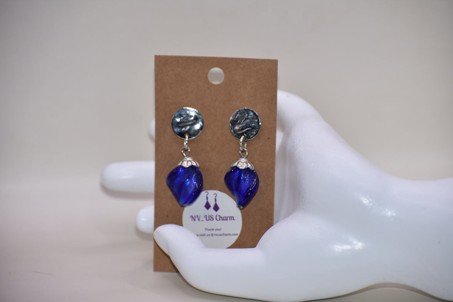 Get ready to add some sparkle to your accessories with the Blue Collection! These earrings feature silver round hypoallergenic posts and hold a stunning sapphire blue stone. Dress them up or down for any occasion - these earrings are the perfect addition to any outfit!