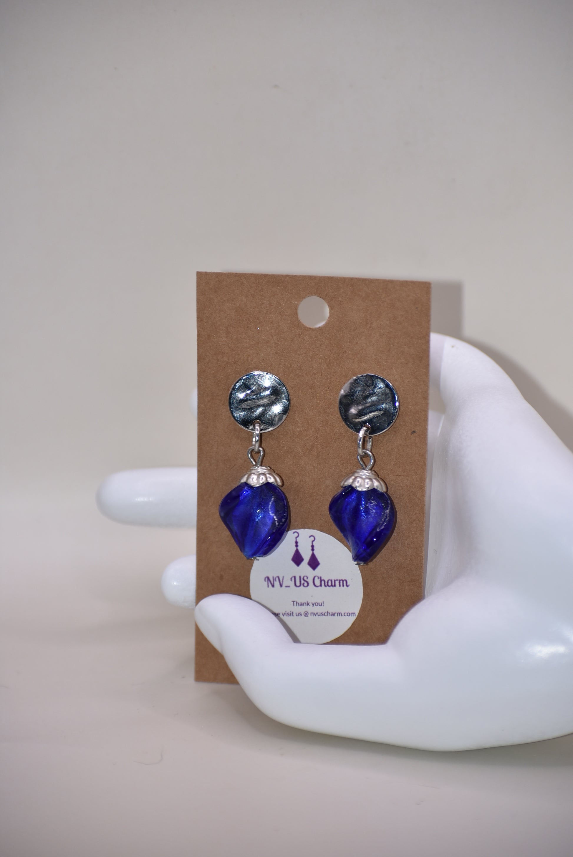 Get ready to add some sparkle to your accessories with the Blue Collection! These earrings feature silver round hypoallergenic posts and hold a stunning sapphire blue stone. Dress them up or down for any occasion - these earrings are the perfect addition to any outfit!