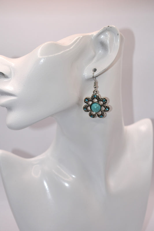 Introducing the Western Collection earrings - perfect for any occasion! With silver hypoallergenic posts, a stunning turquoise stone and blue crystal accents, these earrings are both stylish and gentle on your ears. Dress them up or down and prepare to fall in love with this pair!