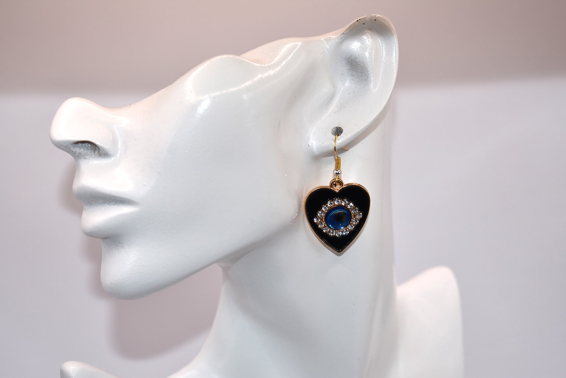 Introducing our Blue Collection, featuring our stunning evil eye earrings. These hypoallergenic earrings not only make a statement, but also provide protection from evil eyes. The black background makes the evil eye pop, adding a touch of beauty to your look. (You'll literally be turning heads)